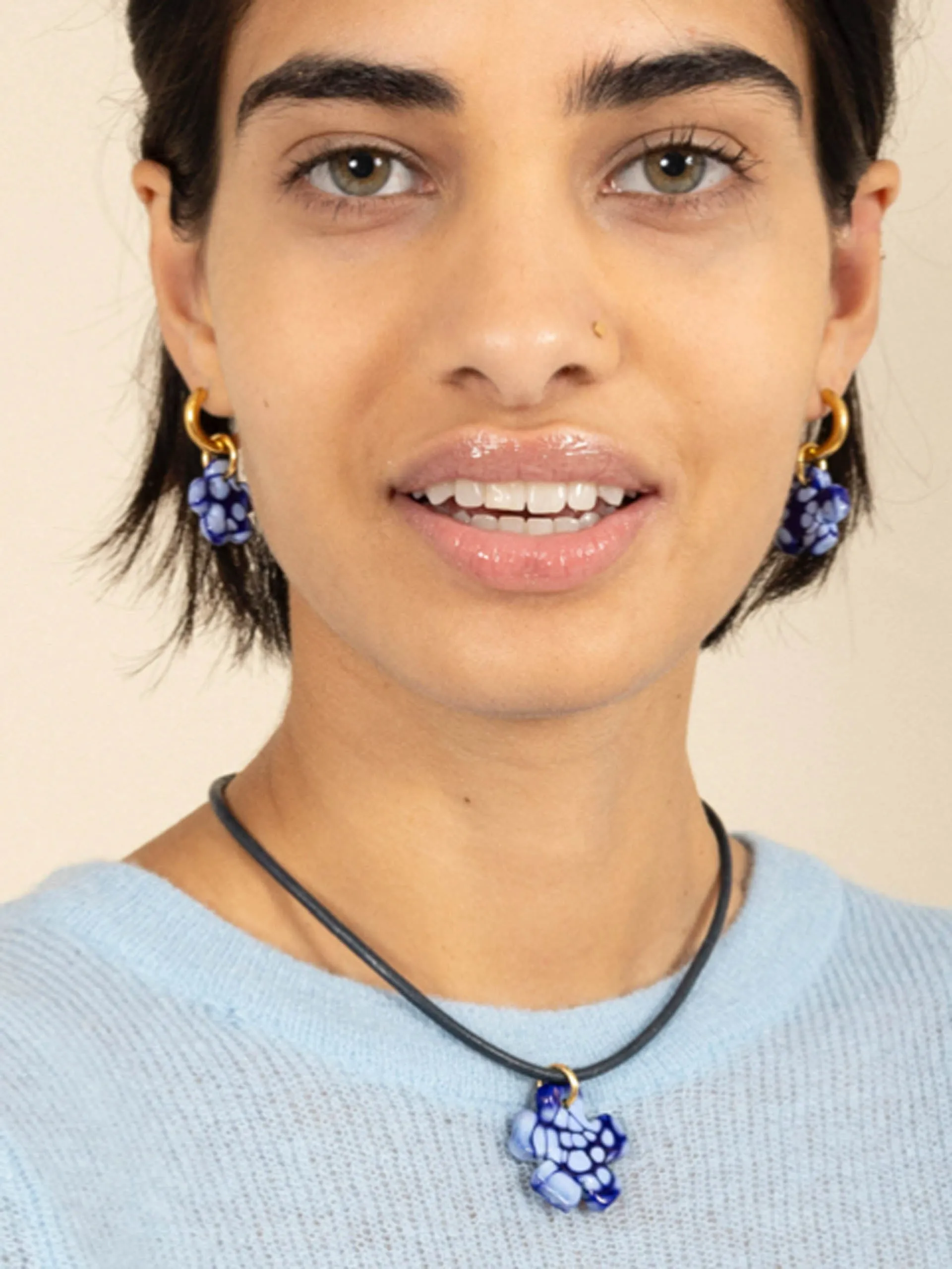 Blue clover leather cord necklace